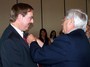 Marty Muehe, son of former Rotarian Bob Muehe, receives the pendant and lapel pin from our President, Jack Moran to become Rotarys 